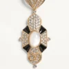 Cercei Pas Plus din metal, rășină, email și cristale Swarovski® Cercei Pas Plus din metal, rășină, email și cristale Swarovski®