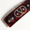 Clemă de păr Vlogo Signature din rășină, metal și cristale Clemă de păr Vlogo Signature din rășină, metal și cristale