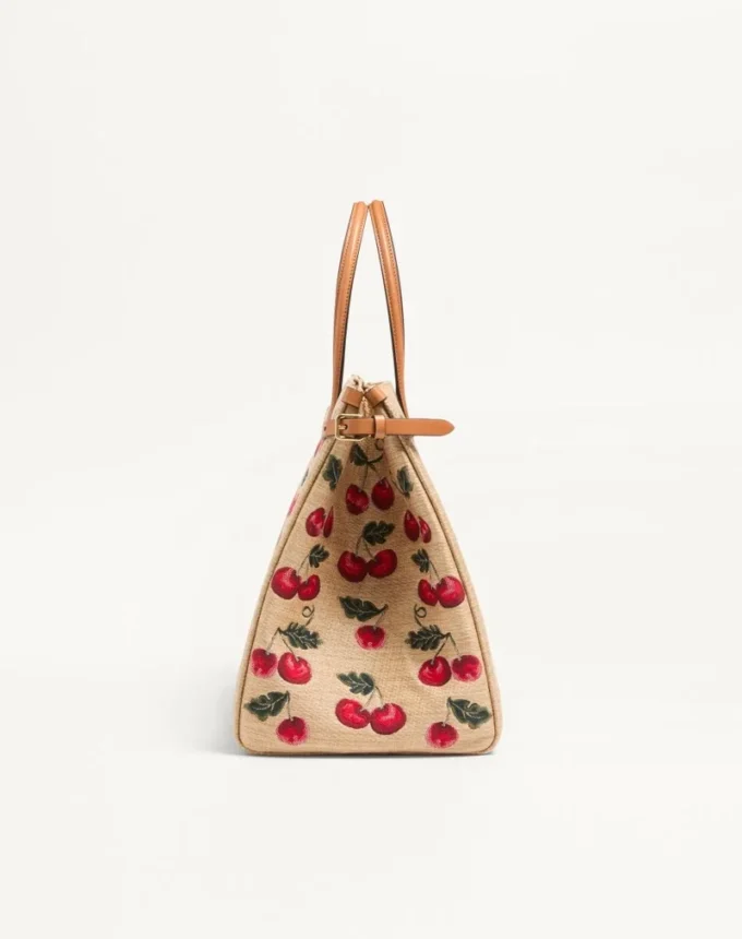 Geantă de cumpărături medie Valentino Garavani Antibes din rafie jacquard cu motiv Cherryfic Geantă de cumpărături medie Valentino Garavani Antibes din rafie jacquard cu motiv Cherryfic