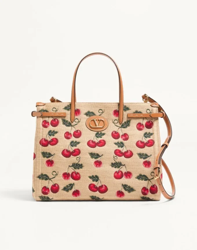 Geantă de cumpărături medie Valentino Garavani Antibes din rafie jacquard cu motiv Cherryfic Geantă de cumpărături medie Valentino Garavani Antibes din rafie jacquard cu motiv Cherryfic