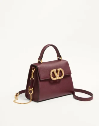 Geantă de mână Valentino Garavani Vsling din piele de vițel granată cu logo bijuterie
