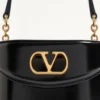 Geantă de toaletă Valentino Garavani Vain din piele de vițel lucioasă Geantă de toaletă Valentino Garavani Vain din piele de vițel lucioasă