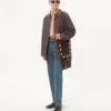 Geantă de umăr Valentino Garavani Nellcôte din piele de căprioară cu franjuri Geantă de umăr Valentino Garavani Nellcôte din piele de căprioară cu franjuri