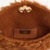 Geantă mică de umăr Valentino Garavani DeVain din blană de miel cu strasuri. Geantă mică de umăr Valentino Garavani DeVain din blană de miel cu strasuri.