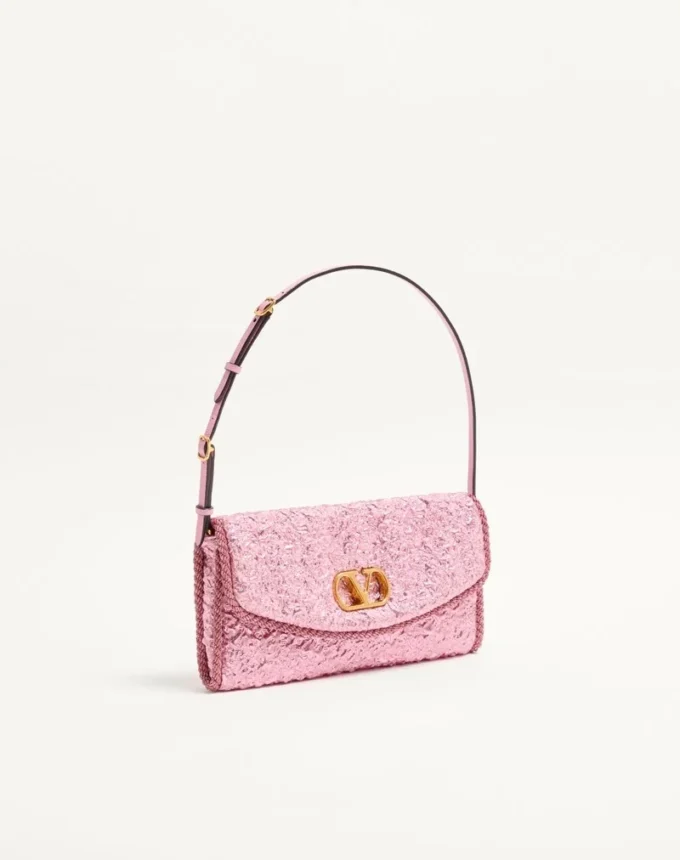 Geantă mică de umăr Valentino Garavani DeVain din țesătură jacquard cloqué. Geantă mică de umăr Valentino Garavani DeVain din țesătură jacquard cloqué.