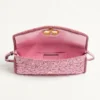 Geantă mică de umăr Valentino Garavani DeVain din țesătură jacquard cloqué. Geantă mică de umăr Valentino Garavani DeVain din țesătură jacquard cloqué.