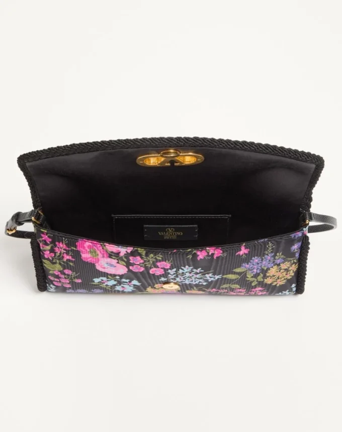 Geantă mică de umăr Valentino Garavani DeVain din țesătură moiré cu imprimeu floral Geantă mică de umăr Valentino Garavani DeVain din țesătură moiré cu imprimeu floral
