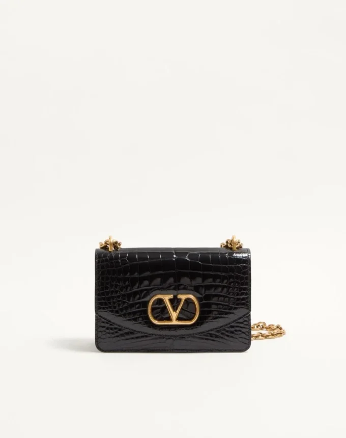 Geantă mică de umăr Valentino Garavani Vain din piele de crocodil Geantă mică de umăr Valentino Garavani Vain din piele de crocodil