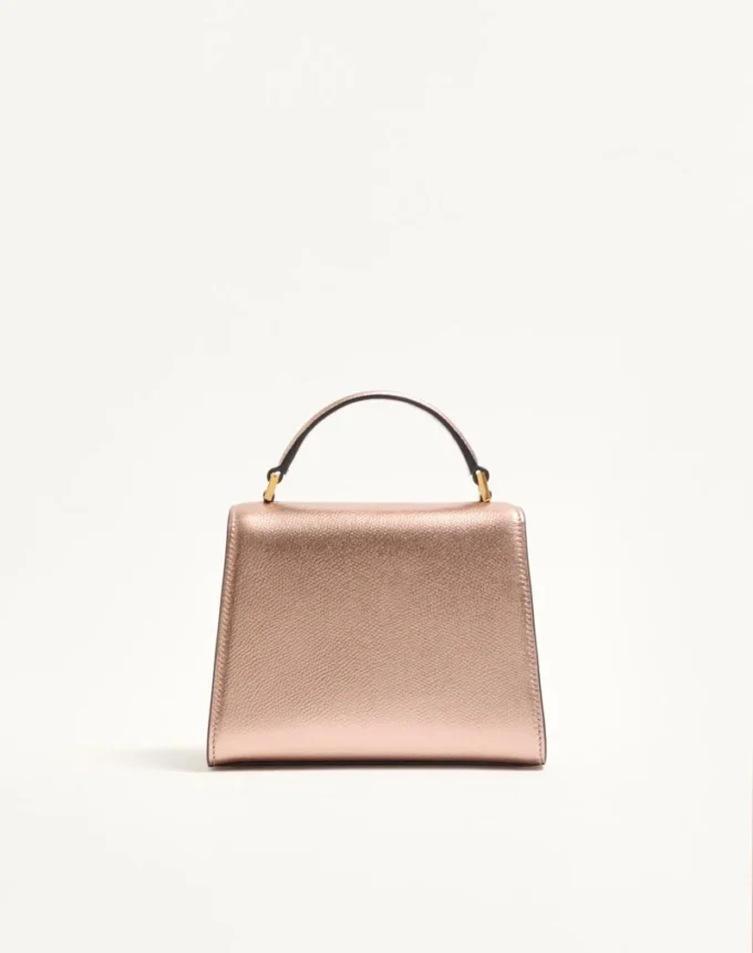 Geantă mini Valentino Garavani Vsling din piele de vițel laminată cu logo bijuterie Geantă mini Valentino Garavani Vsling din piele de vițel laminată cu logo bijuterie