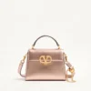 Geantă mini Valentino Garavani Vsling din piele de vițel laminată cu logo bijuterie Geantă mini Valentino Garavani Vsling din piele de vițel laminată cu logo bijuterie