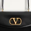 Geantă Valentino Garavani Vain cu mâner din piele de vițel lucioasă Geantă Valentino Garavani Vain cu mâner din piele de vițel lucioasă