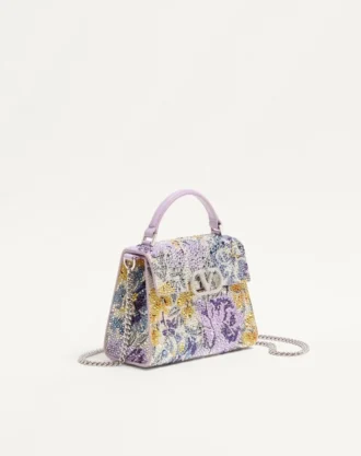 Mini geantă de mână Valentino Garavani Vsling cu motiv Flowerism din strasuri și logo bijuterie