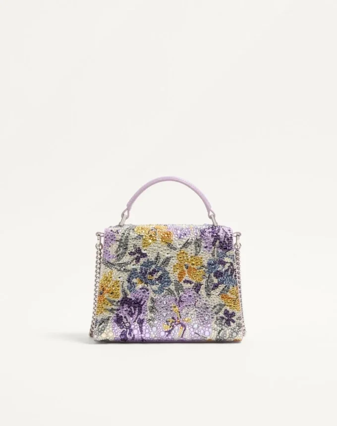 Mini geantă de mână Valentino Garavani Vsling cu motiv Flowerism din strasuri și logo bijuterie Mini geantă de mână Valentino Garavani Vsling cu motiv Flowerism din strasuri și logo bijuterie