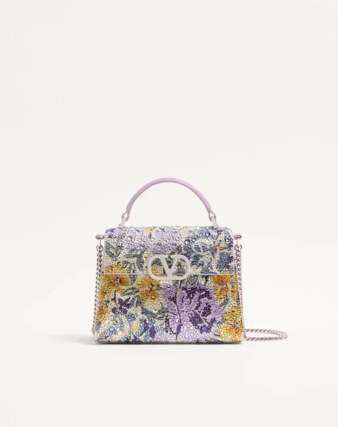 Mini geantă de mână Valentino Garavani Vsling cu motiv Flowerism din strasuri și logo bijuterie Mini geantă de mână Valentino Garavani Vsling cu motiv Flowerism din strasuri și logo bijuterie