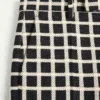 Pantaloni din amestec de lână cu model în carouri și cu revere Pantaloni din amestec de lână cu model în carouri și cu revere