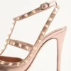 Pantofi cu toc Rockstud din piele nappa laminată 100 mm