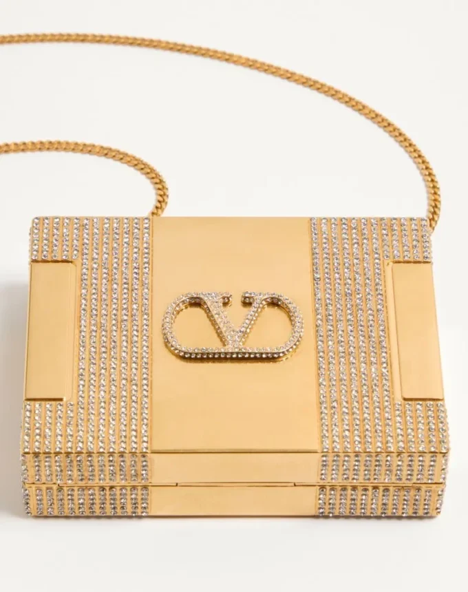 Valentino Garavani Minaumorphe Minaudière din metal cu cristale Swarovski® și husă din satin